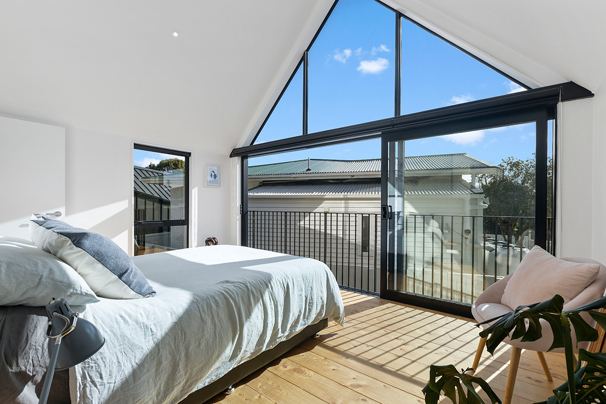 sun shining through windows into bedroom